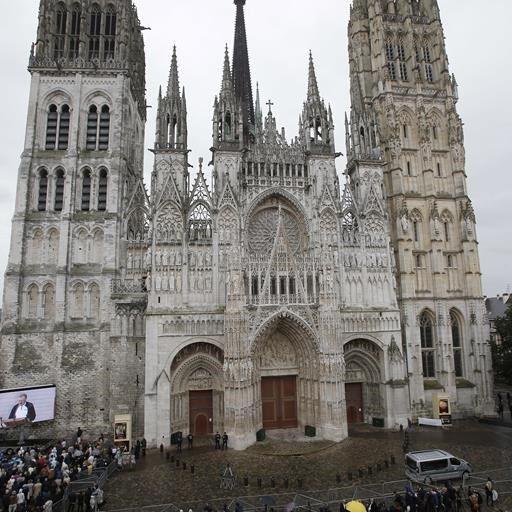 Small fire in towering spire of medieval cathedral in French city of Rouen is under control